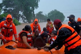 Rescuers search for survivors after heavy rains