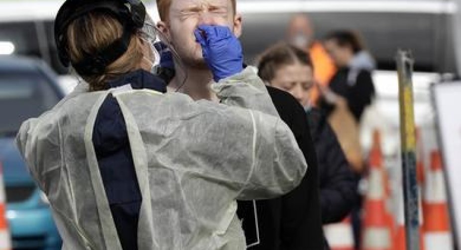New Zealand to roll back social distancing restrictions