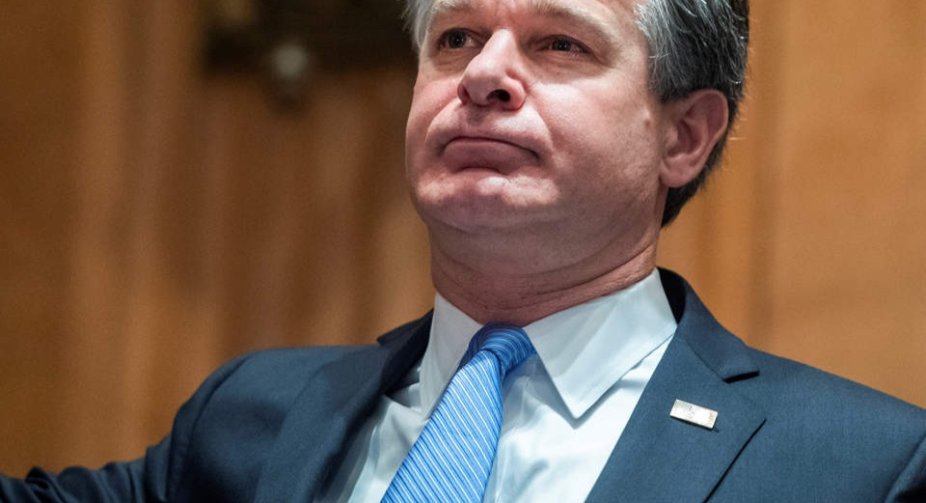 FBI Director Wray knocks down conspiracy theory that January 6 rioters were 'fake Trump protesters'