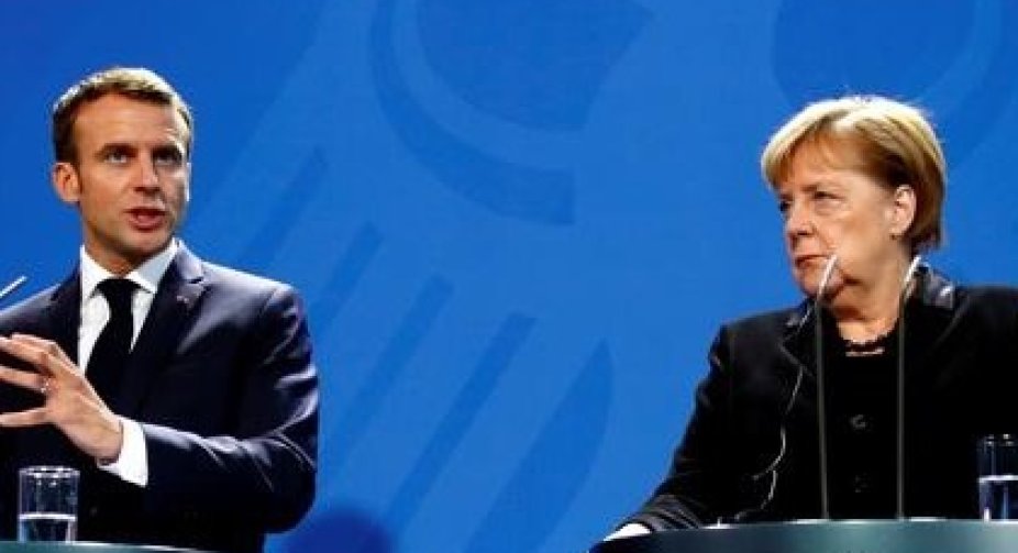 Macron and Merkel urged Russia to commit to stabilizing the ceasefire in Donbas