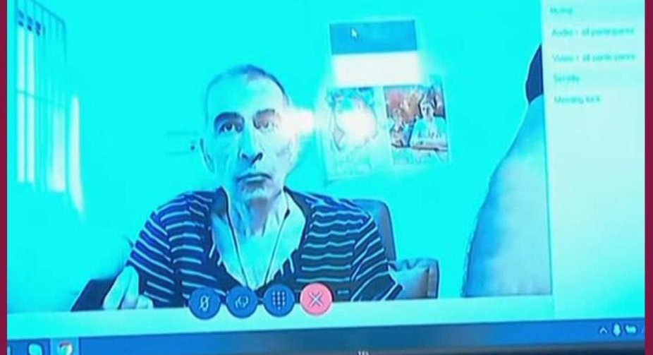 Saakashvili participates in the court remotely.  The photo shows how much he lost weight